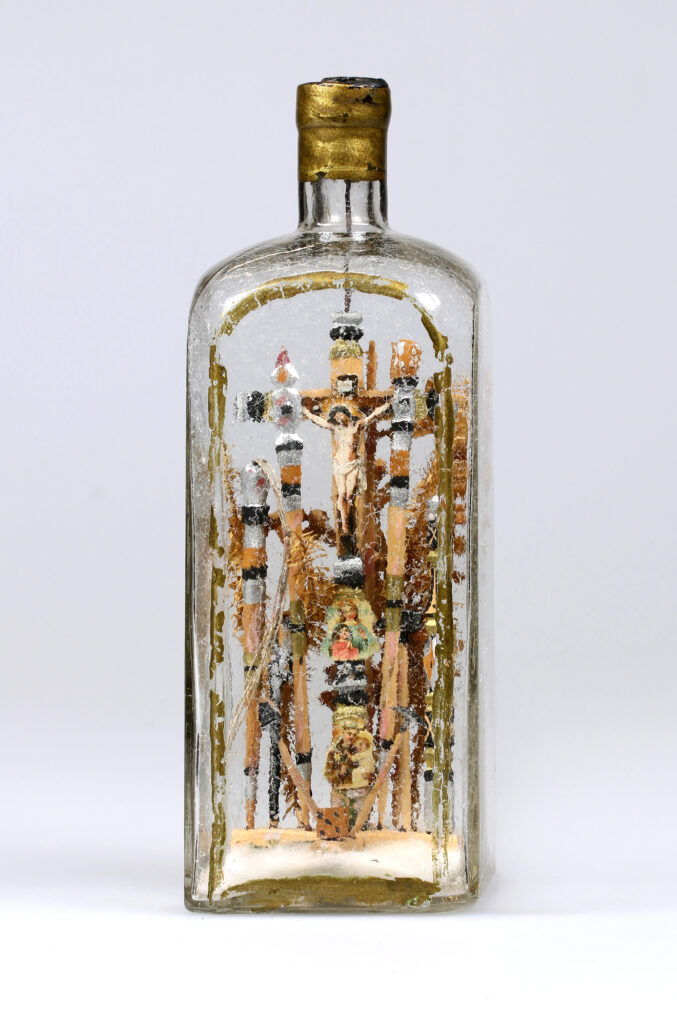 Flaschenherrgott oder Arma Christi?